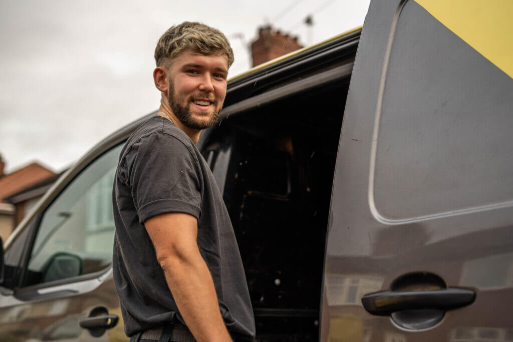 Matty from LS Electrical Services, in front of the company van.